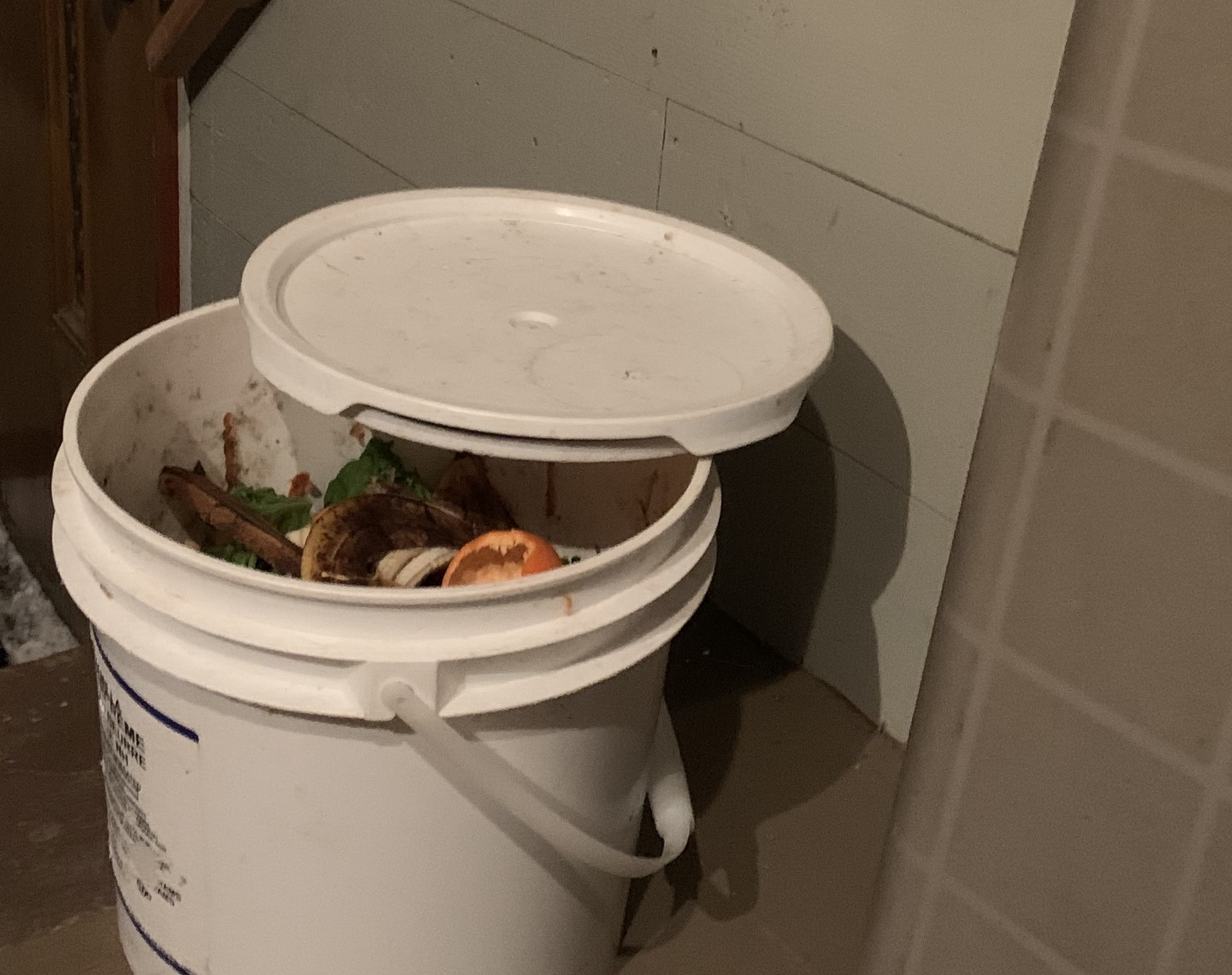Compost pail in cold winter porch