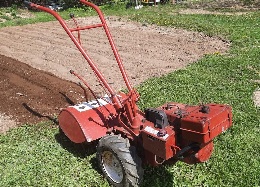 Rototiller and fleshly tilled garden